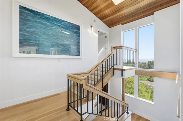 a bedroom with a large bed and a large window
