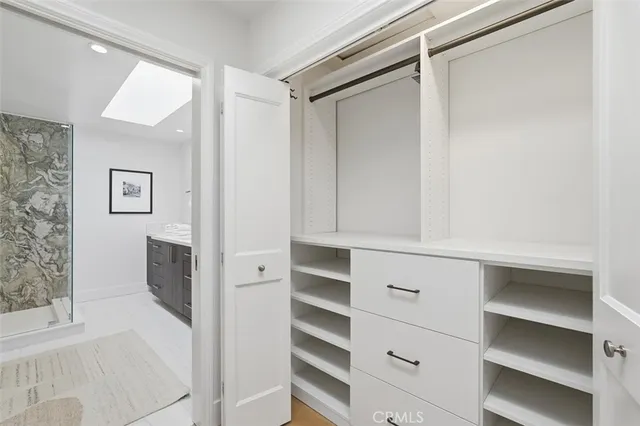 a white bath tub sitting next to a toilet