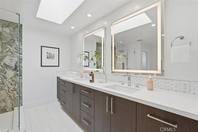 a bedroom with a bed and a large mirror