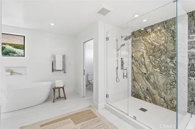 a bathroom with a shower and a sink