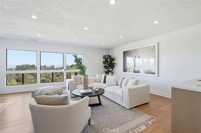 a bedroom with a large bed and a large window