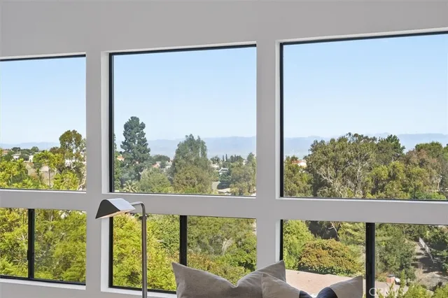 a view of a two chairs in the balcony