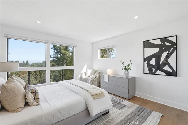 a view of a patio with table and chairs and potted plants