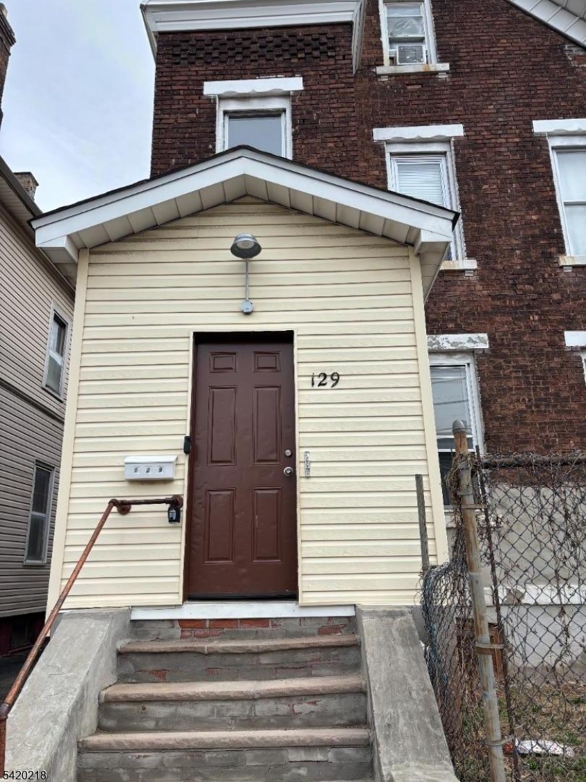127 Fulton Street Elizabeth Port, NJ 07206 - Photo 1 of 21 a front view of a house