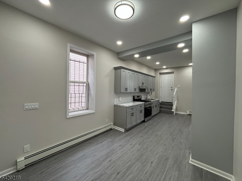 127 Fulton Street Elizabeth Port, NJ 07206 - Photo 7 of 21 a view of a room with kitchen appliances and a window