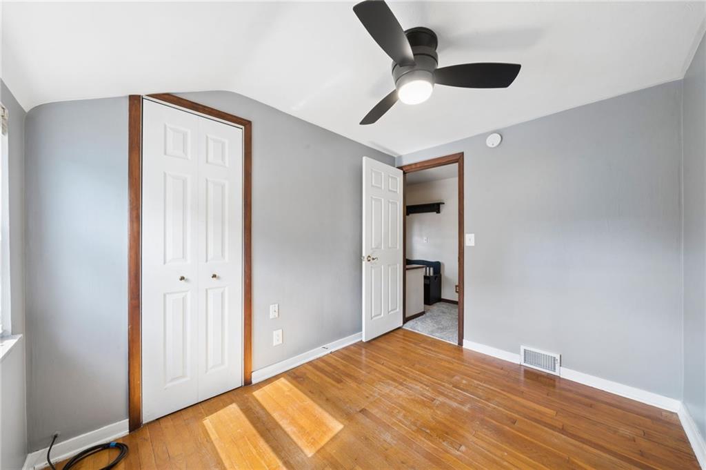 711 Jane Street Pittsburgh, PA 15239 - Photo 13 of 27 The bright third bedroom showcases gorgeous hardwood flooring and a clean, neutral color palette. Equipped with a modern ceiling fan and ample closet storage.