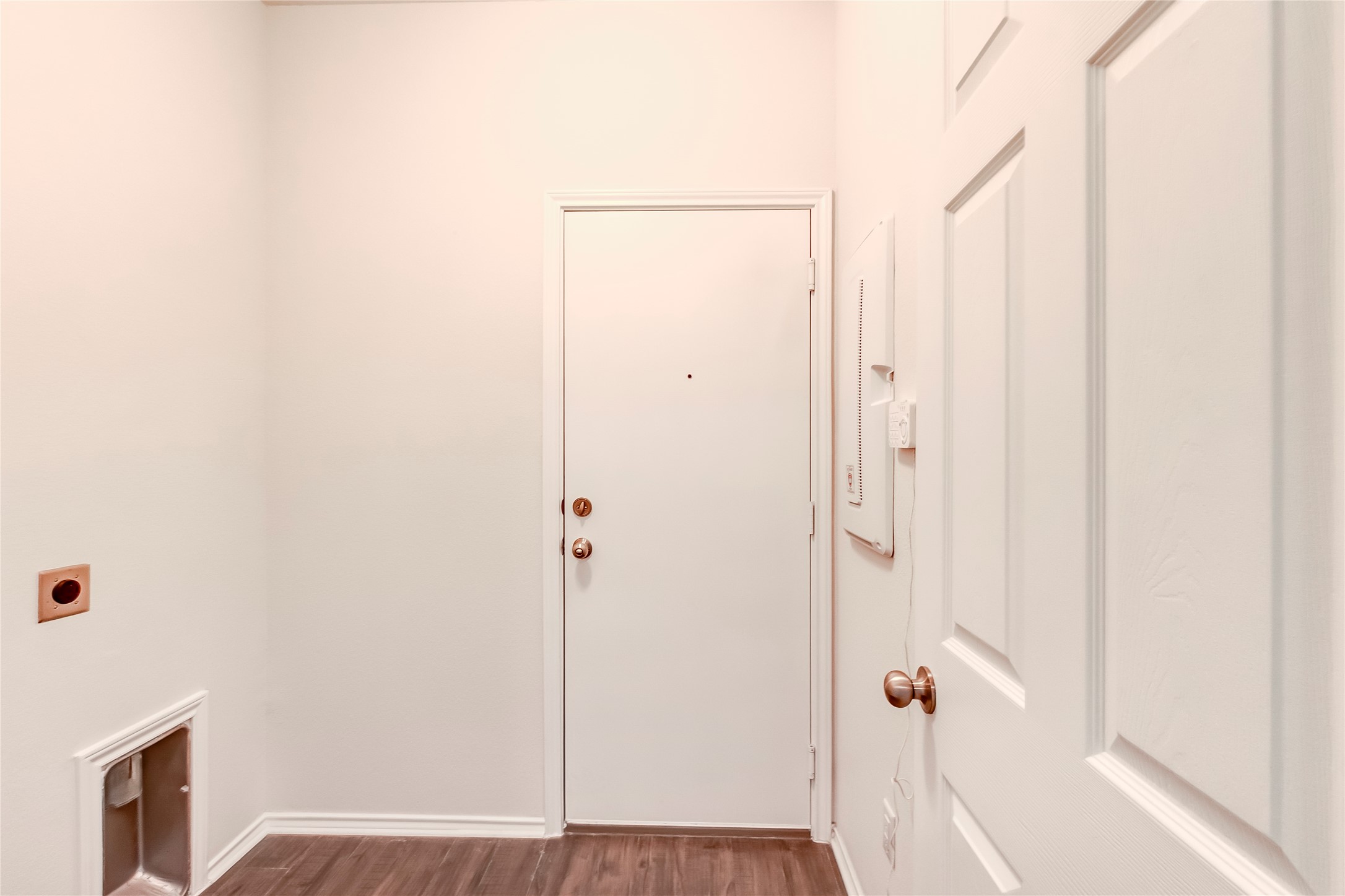 11617 Amber Stream Lane Manor, TX 78653 - Photo 21 of 39 Laundry area featuring dark wood finished floors and hookup for an electric dryer