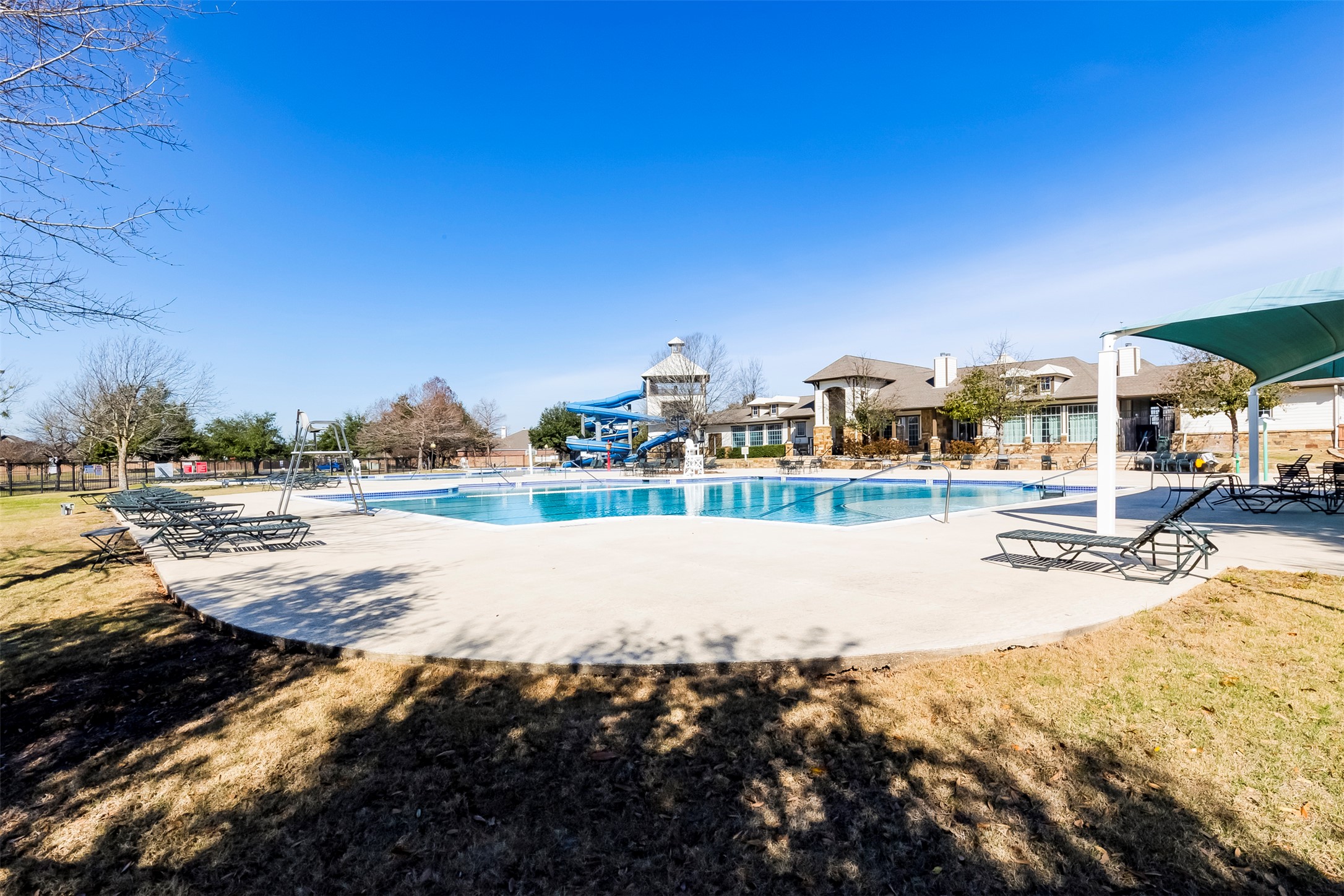 11617 Amber Stream Lane Manor, TX 78653 - Photo 37 of 39 Community pool featuring a patio