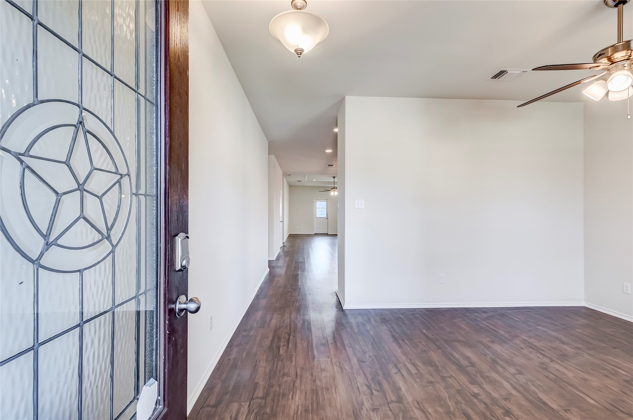 11617 Amber Stream Lane Manor, TX 78653 - Photo 5 of 39 Foyer entrance with a ceiling fan, dark wood-type flooring, and recessed lighting