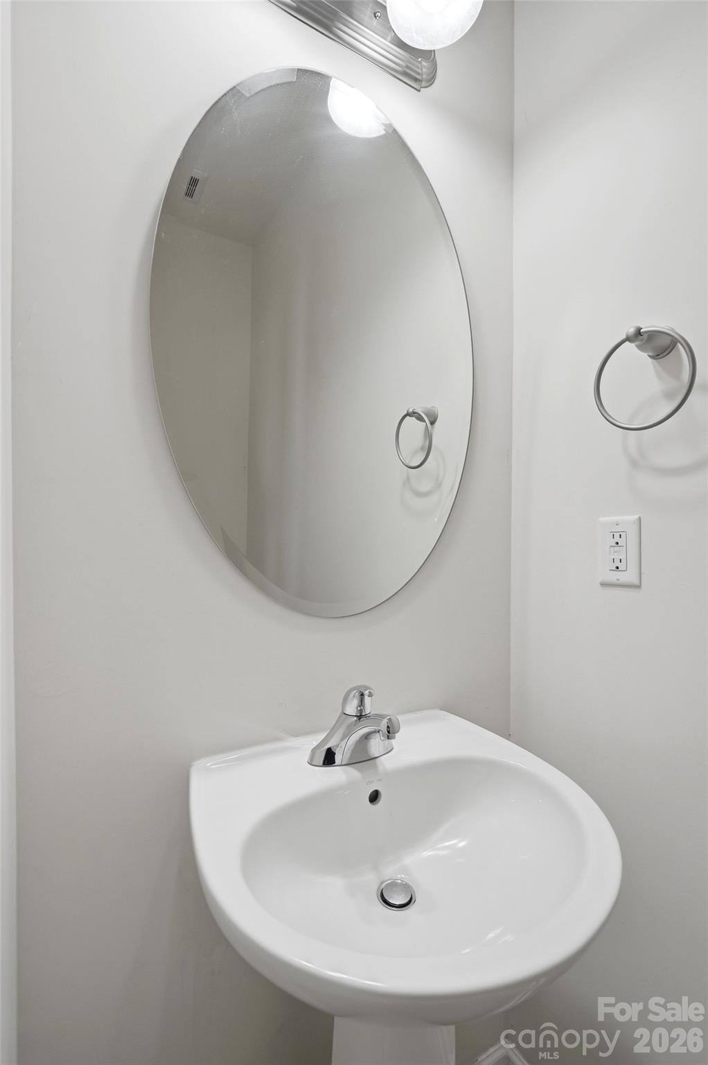 175 Limerick Road, Unit B Mooresville, NC 28115 - Photo 14 of 30 a bathroom with a sink and mirror