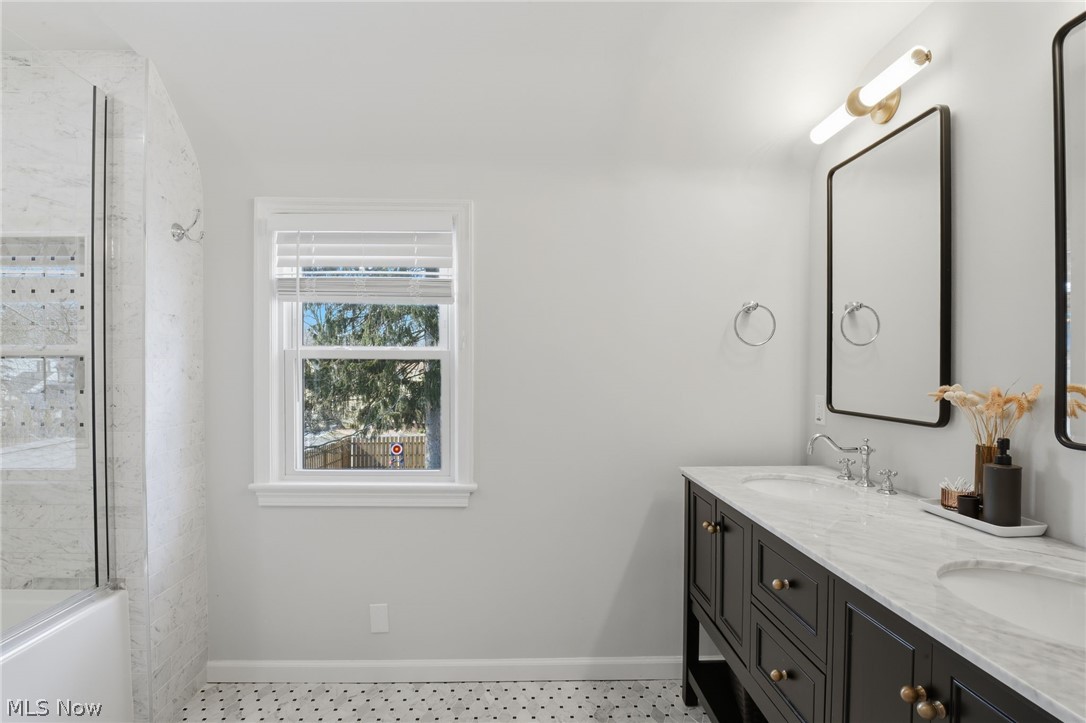 1390 Brainard Road Lyndhurst, OH 44124 - Photo 21 of 33 Bathroom featuring double vanity, enclosed tub / shower combo, and light floors