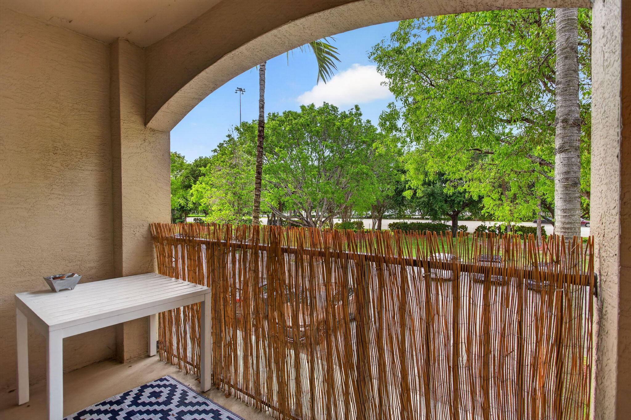 5880 West Sample Road, Unit 206 Coral Springs, FL 33067 - Photo 22 of 37 a view of balcony with wooden fence