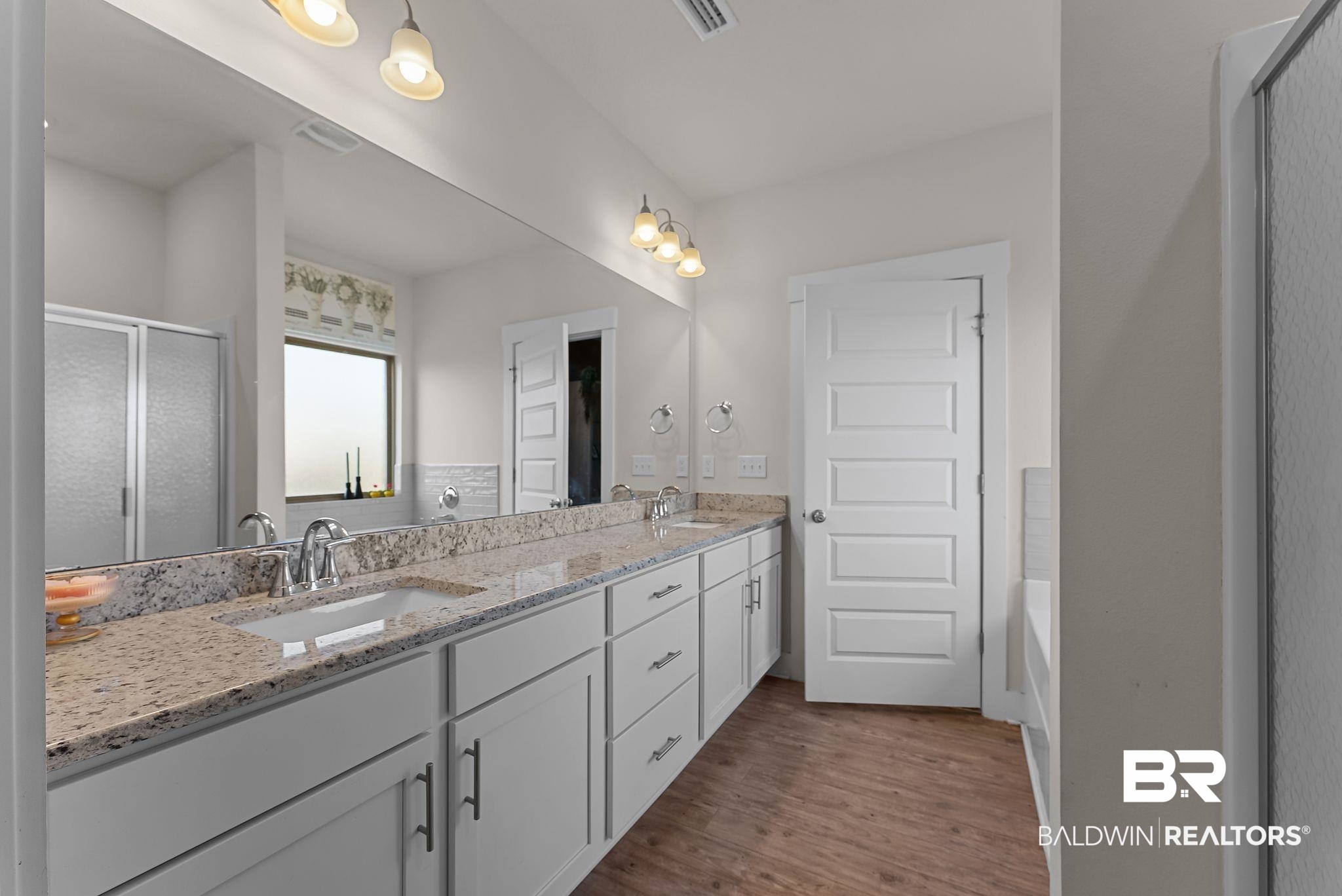 16607 Prado Loop Loxley, AL 36551 - Photo 32 of 46 Dual sink vanity with stone-finish countertop and white cabinetry