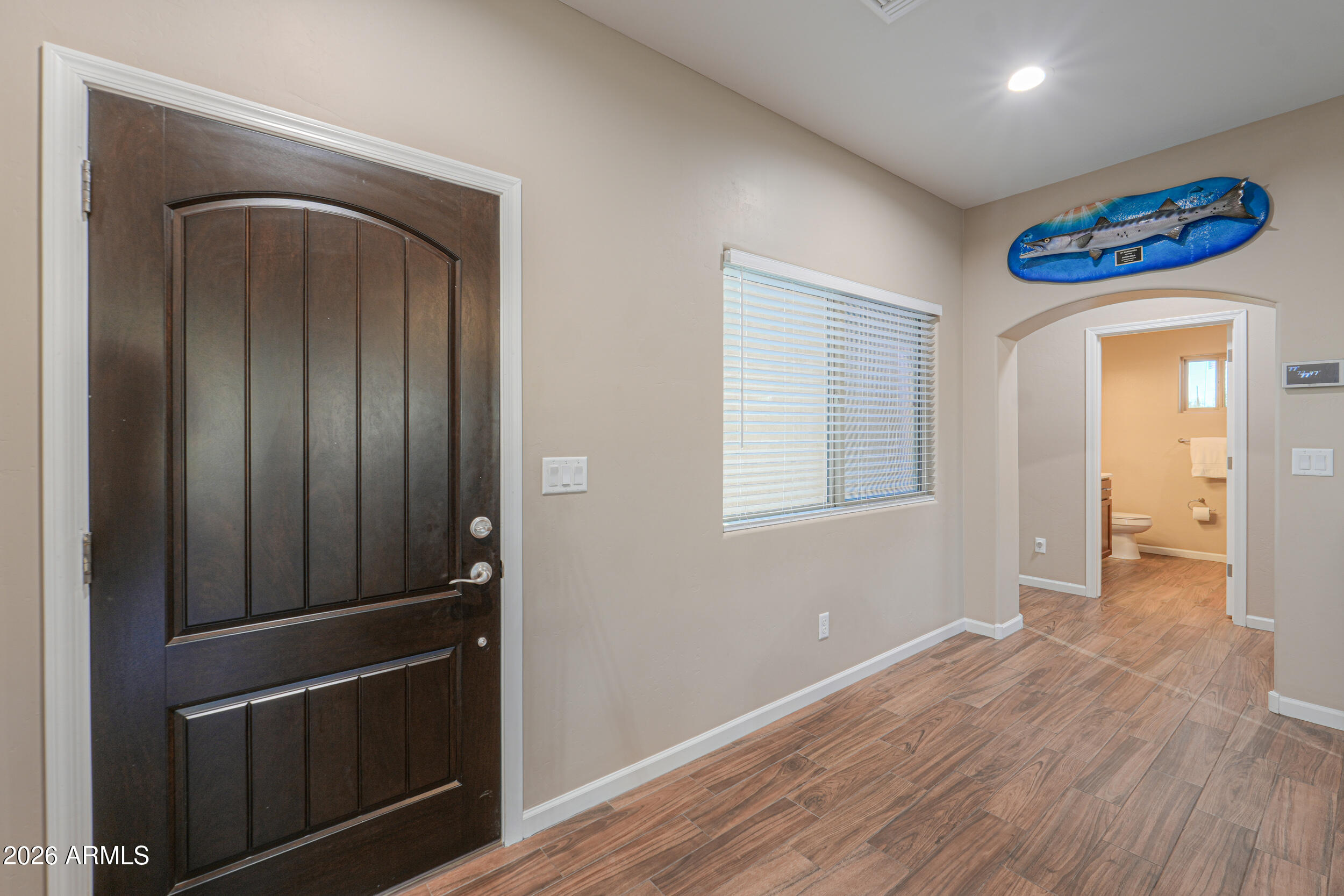 1487 South Mountain View Road Apache Junction, AZ 85119 - Photo 22 of 60 a view of a hallway with wooden floor