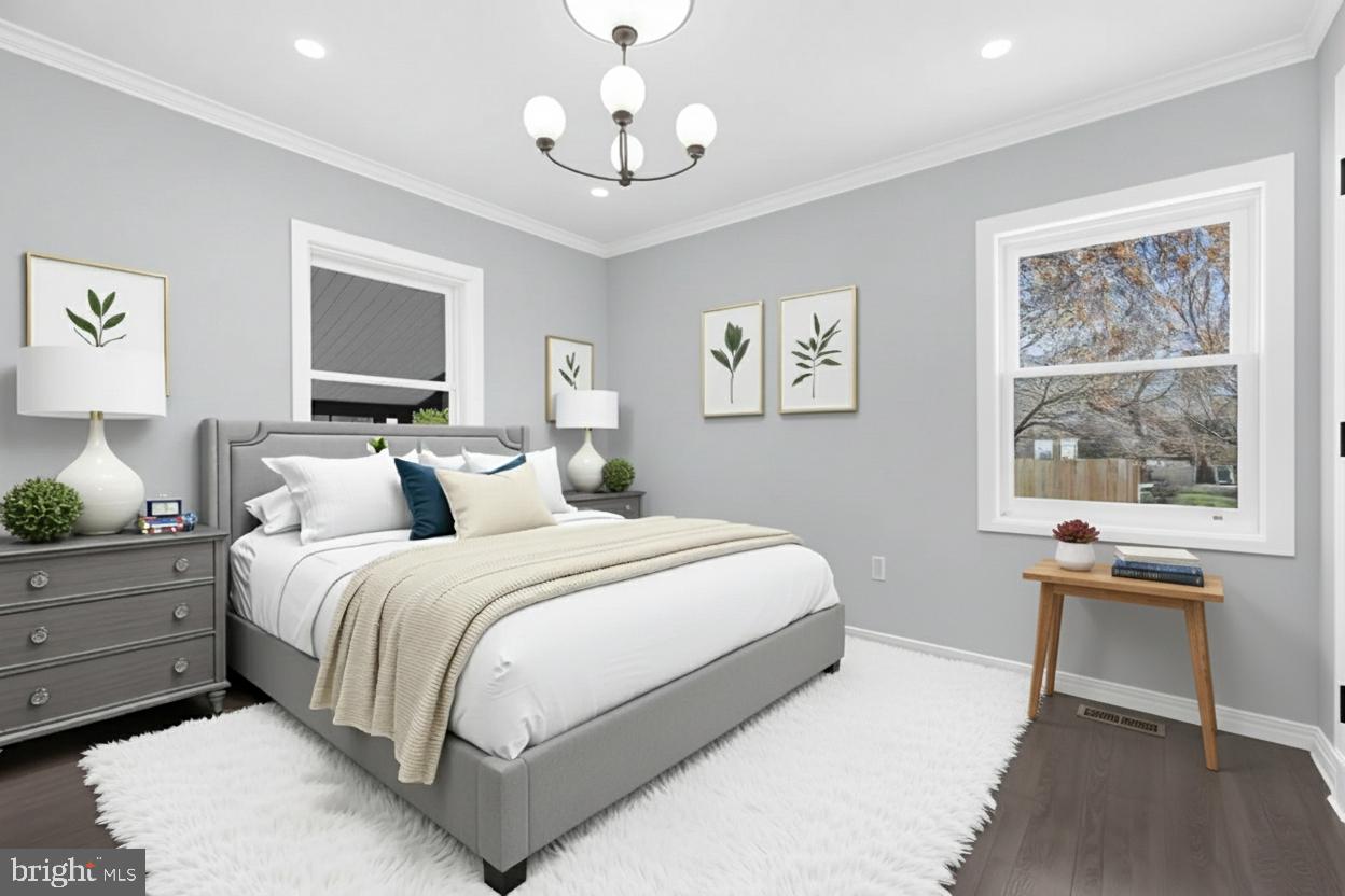 17 Ranchwood Drive Ewing, NJ 08618 - Photo 14 of 33 a spacious bedroom with a bed and a table in it
