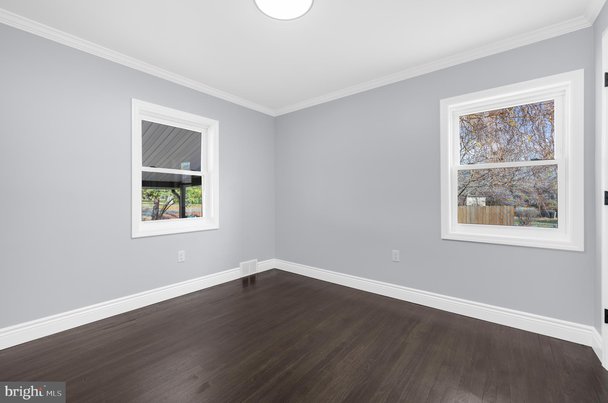 17 Ranchwood Drive Ewing, NJ 08618 - Photo 15 of 33 a view of an empty room with wooden floor and a window