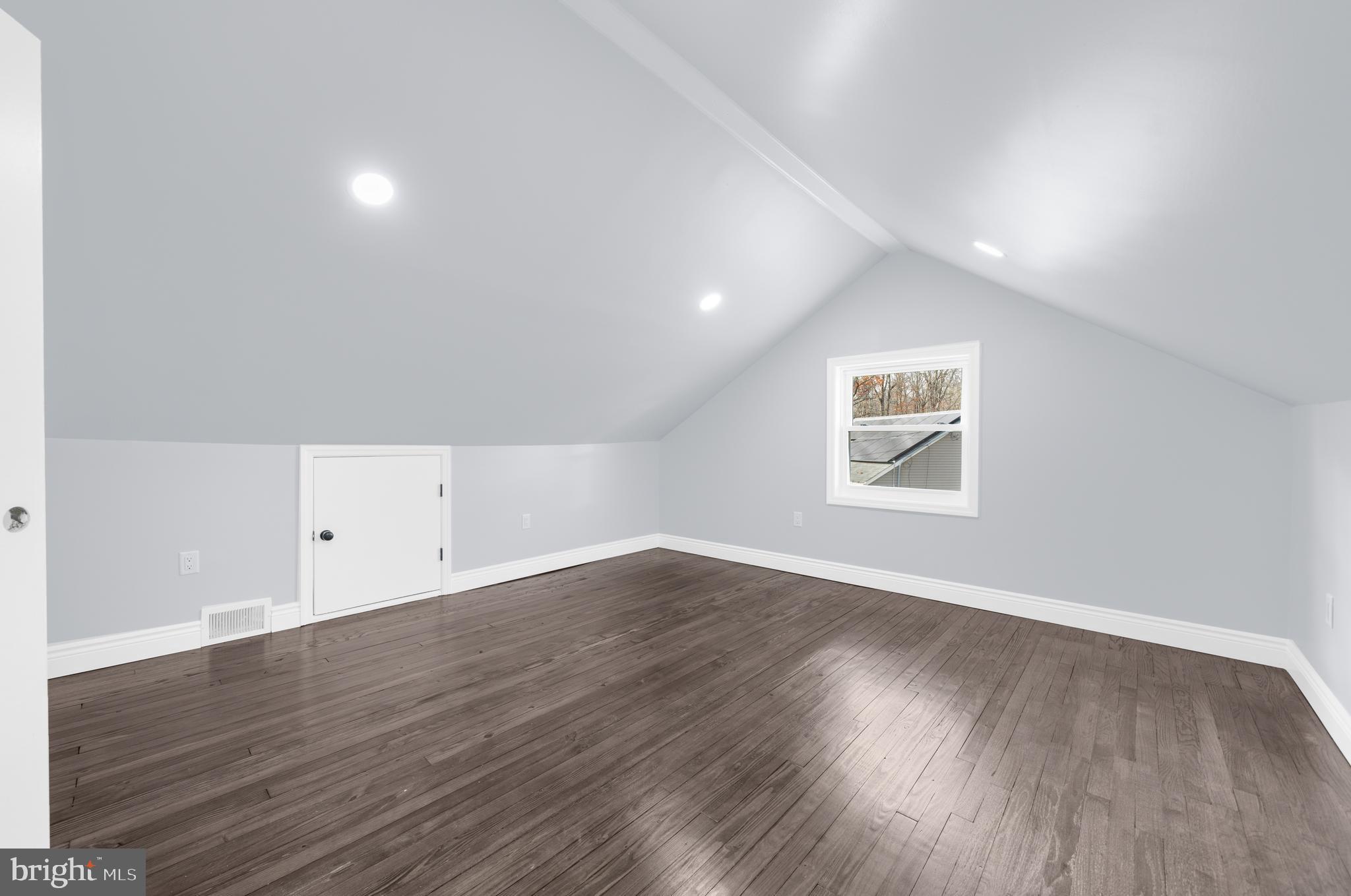 17 Ranchwood Drive Ewing, NJ 08618 - Photo 18 of 33 a view of an empty room with wooden floor and a window