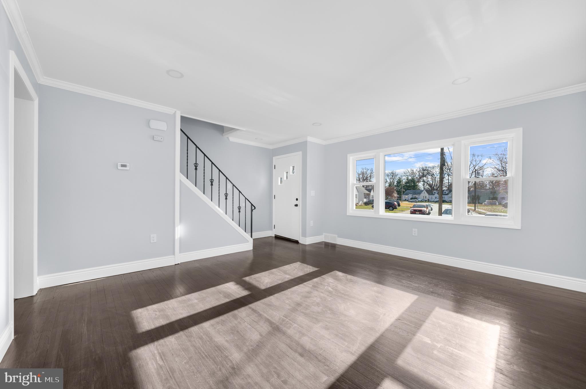 17 Ranchwood Drive Ewing, NJ 08618 - Photo 3 of 33 a view of an empty room with wooden floor and a window