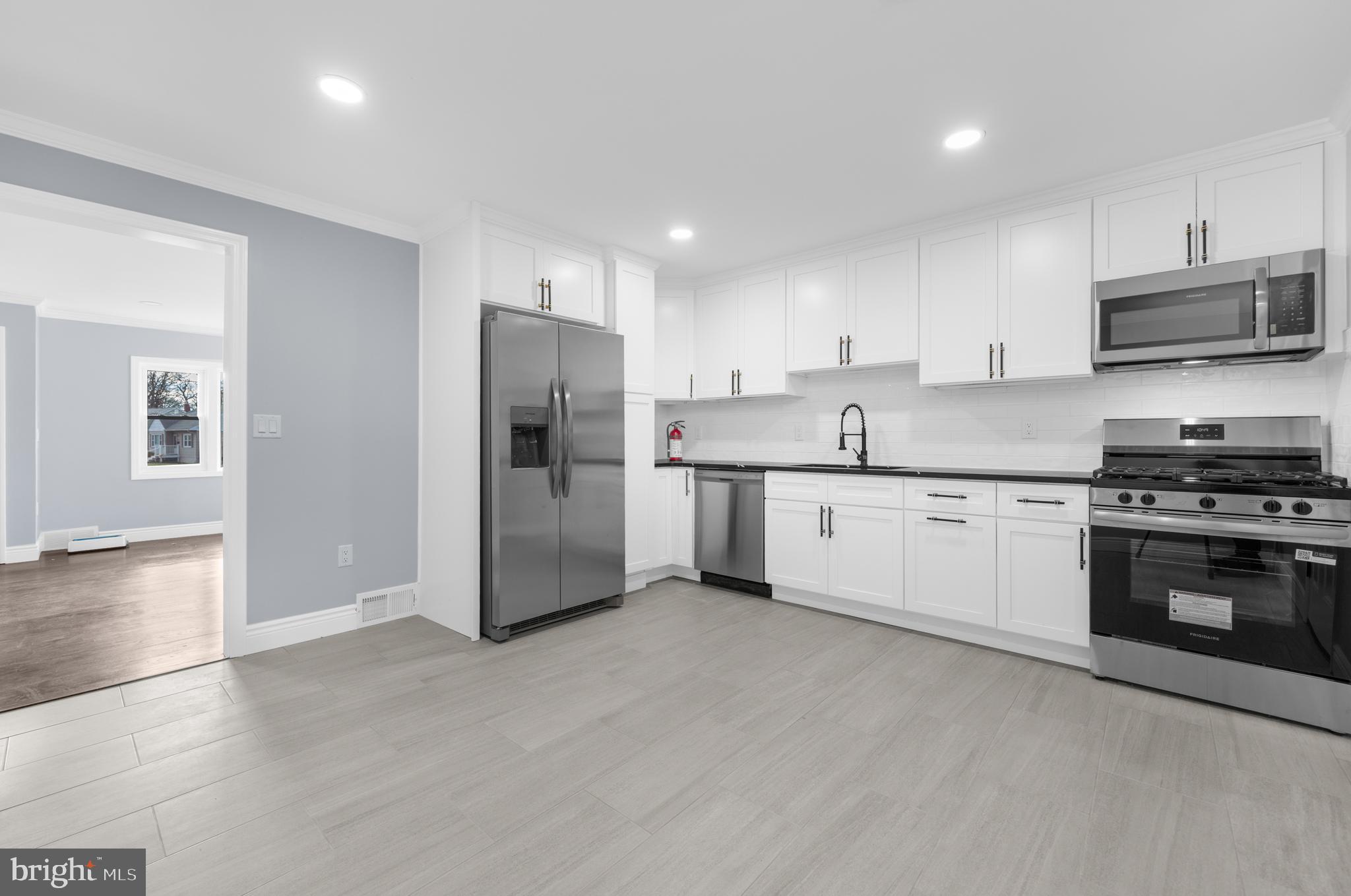17 Ranchwood Drive Ewing, NJ 08618 - Photo 6 of 33 a kitchen with stainless steel appliances a refrigerator sink and stove