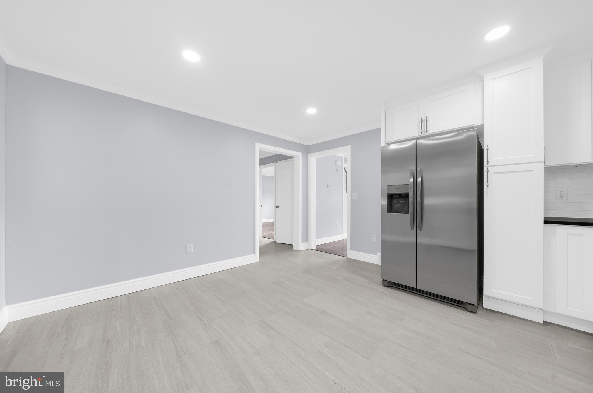 17 Ranchwood Drive Ewing, NJ 08618 - Photo 8 of 33 a view of an empty room with a refrigerator