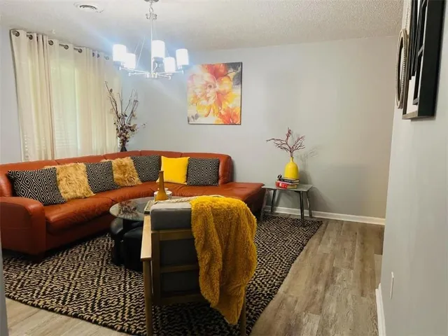 a bedroom with a bed and a television