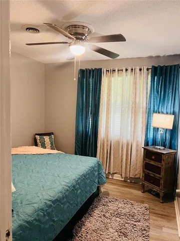 a bathroom with a toilet a sink and shower