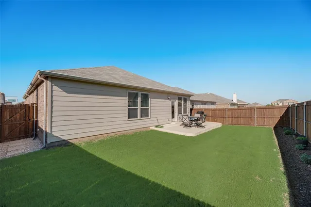 a backyard of a house with seating space