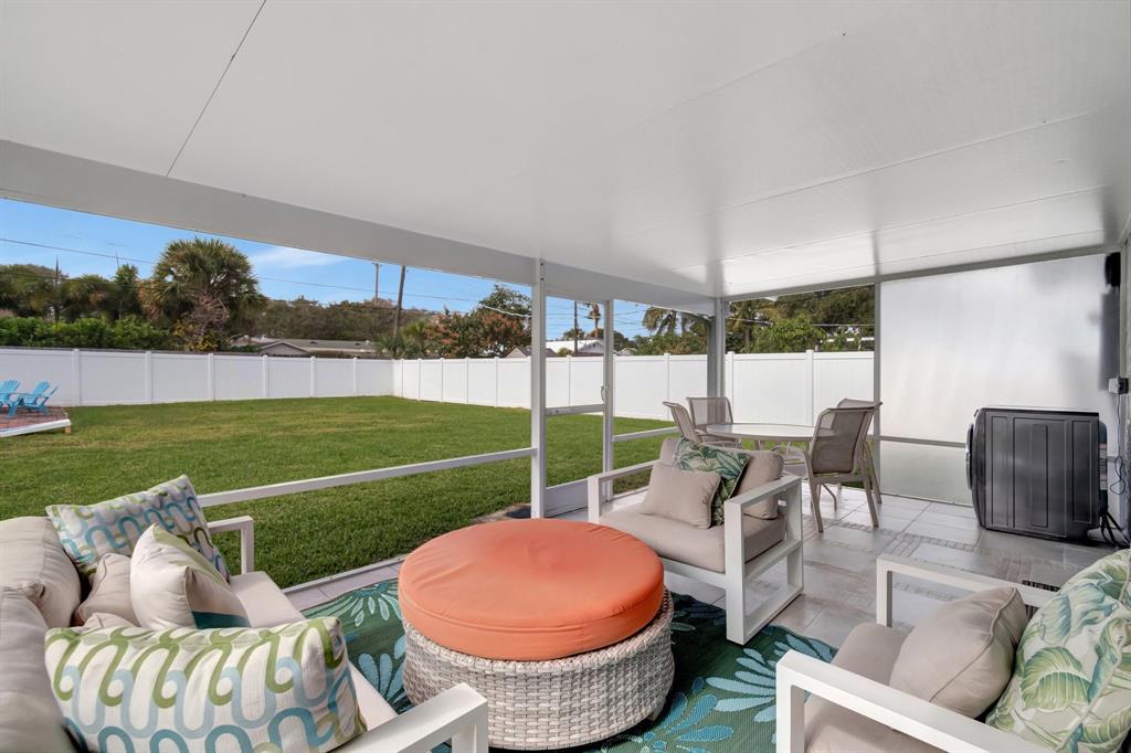 710 Southeast 3rd Avenue Delray Beach, FL 33483 - Photo 24 of 31 a view of a patio with couches chairs and a yard