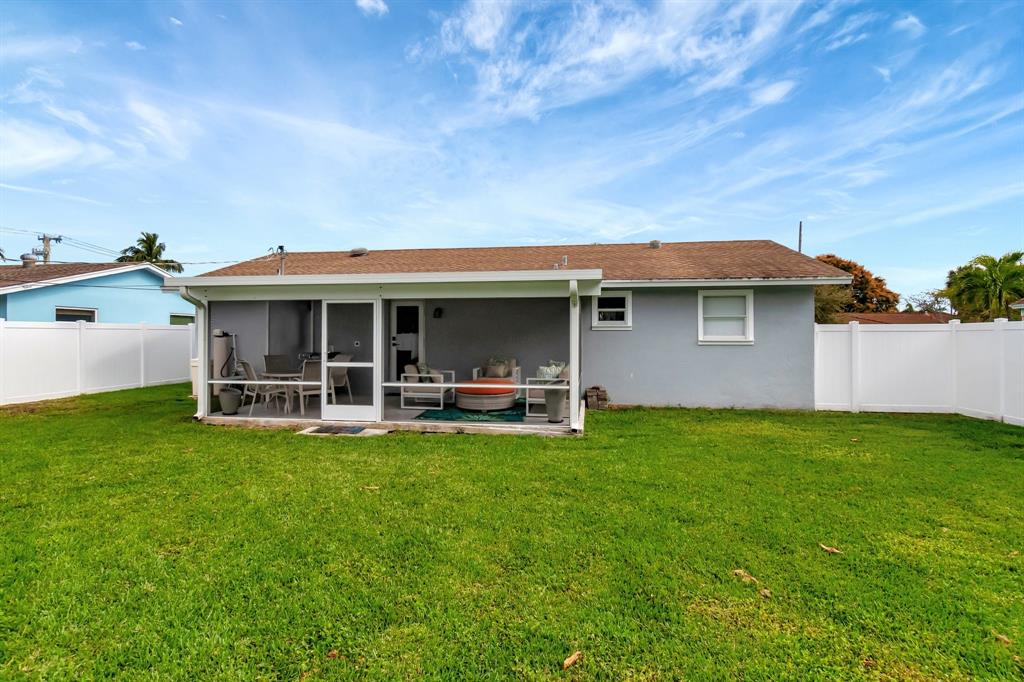 710 Southeast 3rd Avenue Delray Beach, FL 33483 - Photo 26 of 31 a view of a house with backyard porch and garden