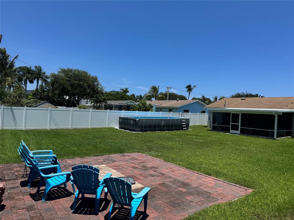 710 Southeast 3rd Avenue Delray Beach, FL 33483 - Photo 28 of 31 a view of a chairs and table in the garden