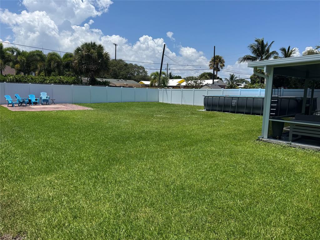 710 Southeast 3rd Avenue Delray Beach, FL 33483 - Photo 29 of 31 a view of yard with swimming pool and green space