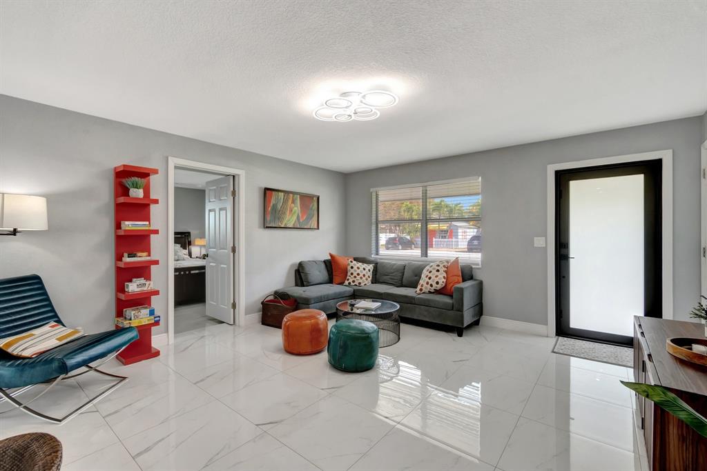 710 Southeast 3rd Avenue Delray Beach, FL 33483 - Photo 3 of 31 a living room with furniture and a window