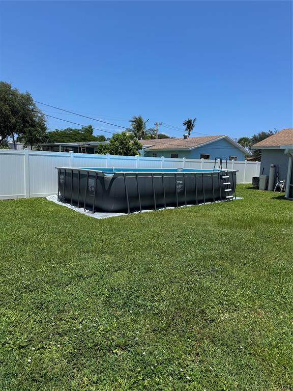 710 Southeast 3rd Avenue Delray Beach, FL 33483 - Photo 31 of 31 a view of a house with a yard and a large tree