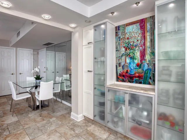 a very nice looking room with a large window and glass door