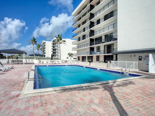 a view of a swimming pool with a patio