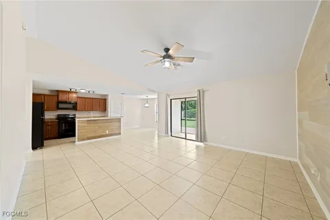 a view of kitchen with furniture and cabinets