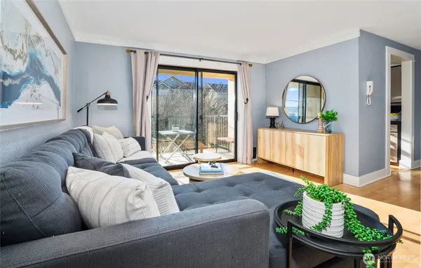 a living room with furniture and a large window