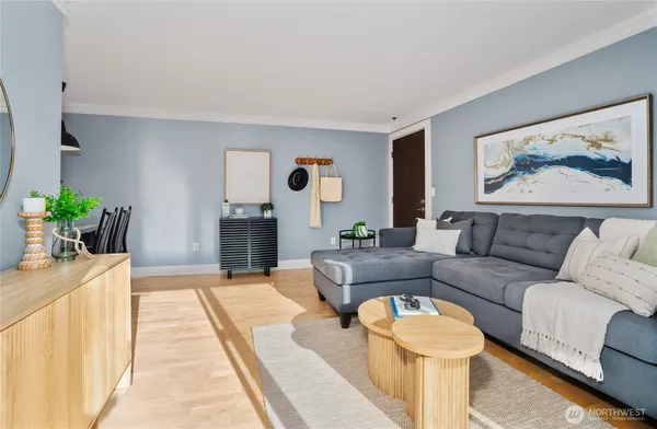 a living room with furniture and a rug