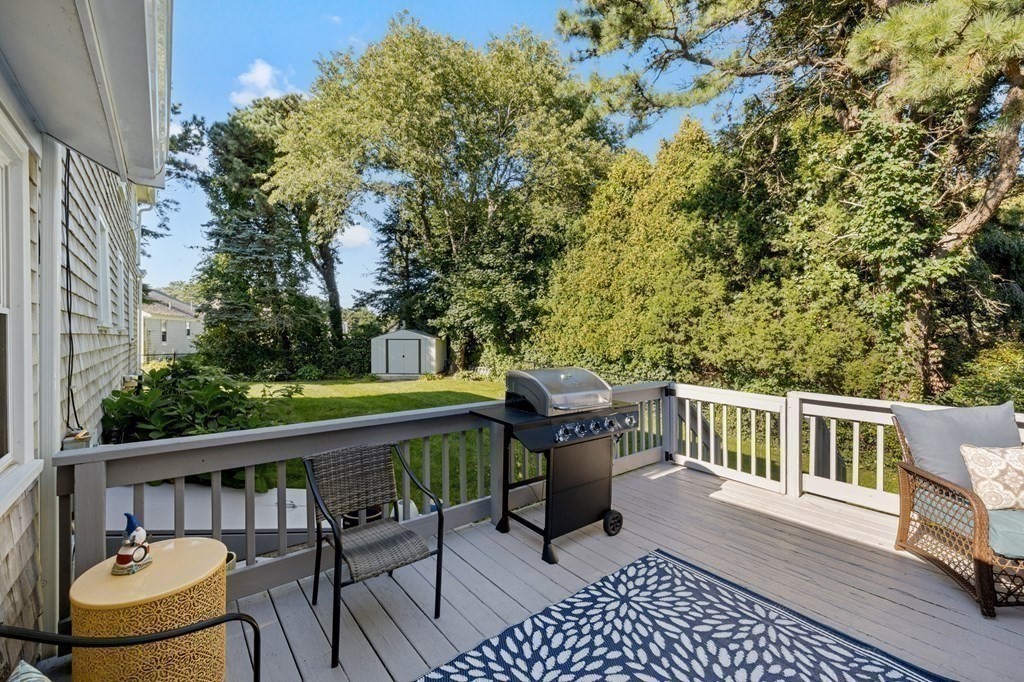 102 Williston Road Bourne, MA 02562 - Photo 9 of 32 a view of a chairs and table on the deck
