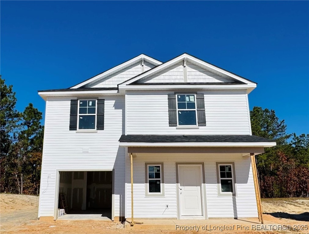 a front view of a house with garage