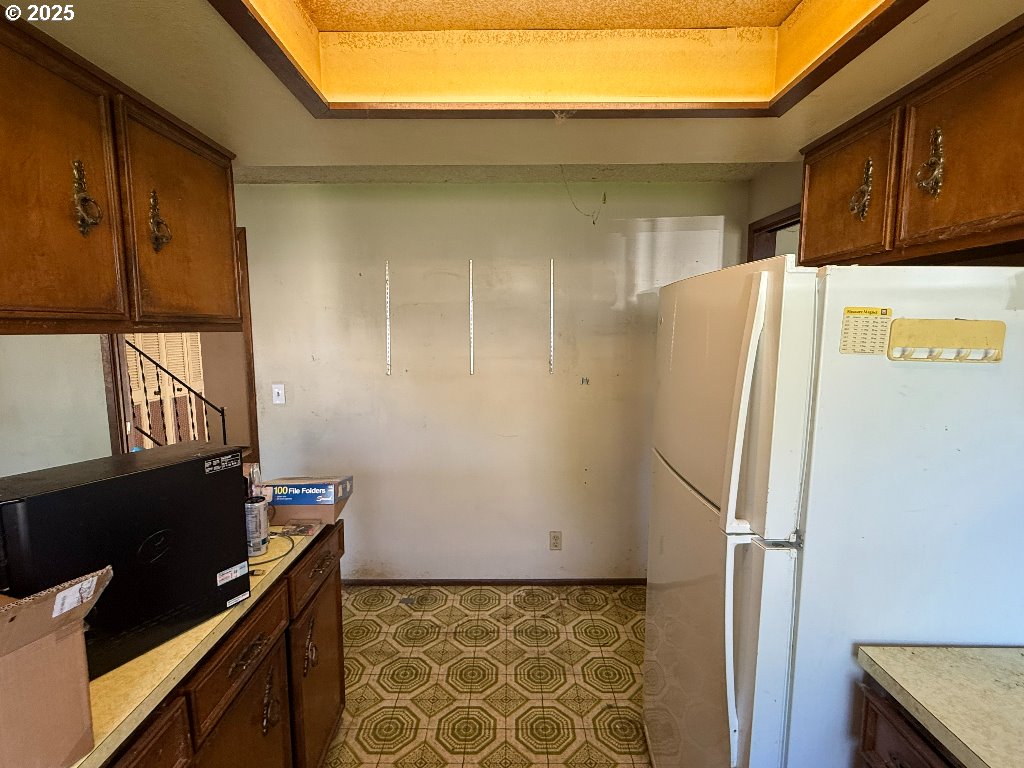 587 71st Street Springfield, OR 97478 - Photo 2 of 19 a kitchen with a refrigerator and a stove