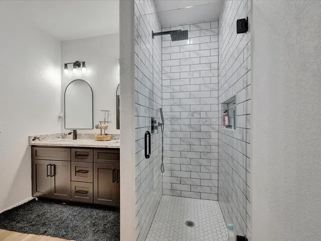 a bathroom with a sink and a mirror