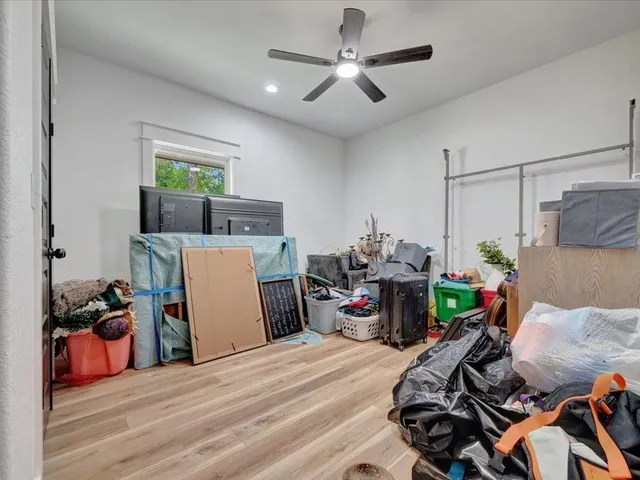 a bed room with a bed and a flat tv screen