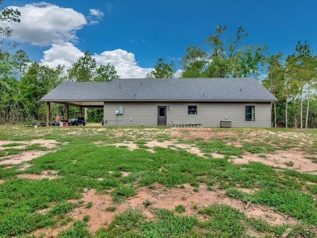 a house with swimming pool in front of it