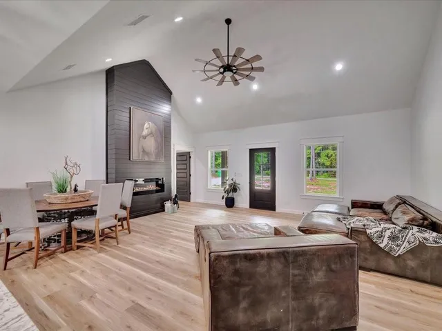 a view of a livingroom with furniture window and wooden floor