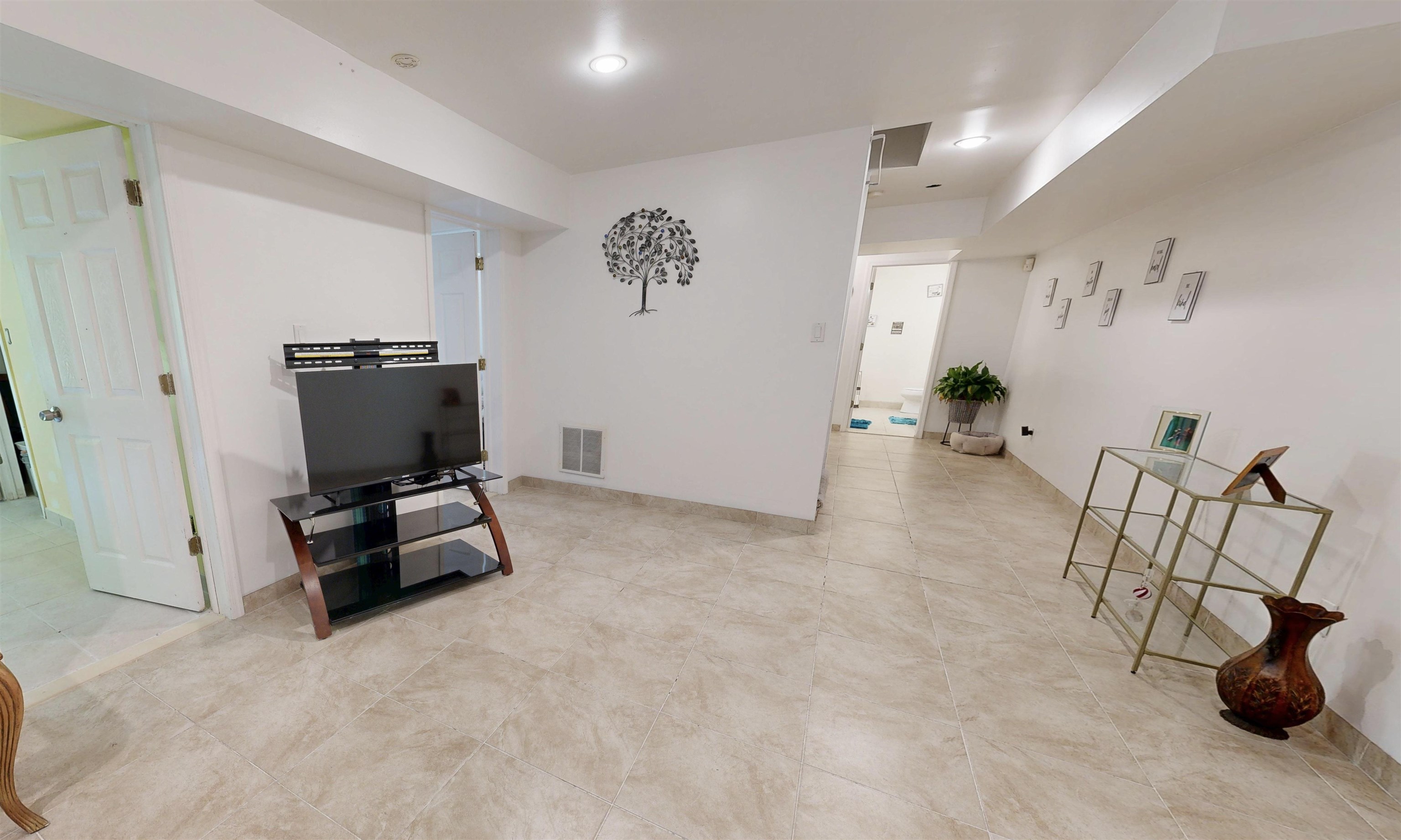 551 Shunpike Road Cape May Court House, NJ 08210 - Photo 29 of 47 a living room with furniture and a flat screen tv