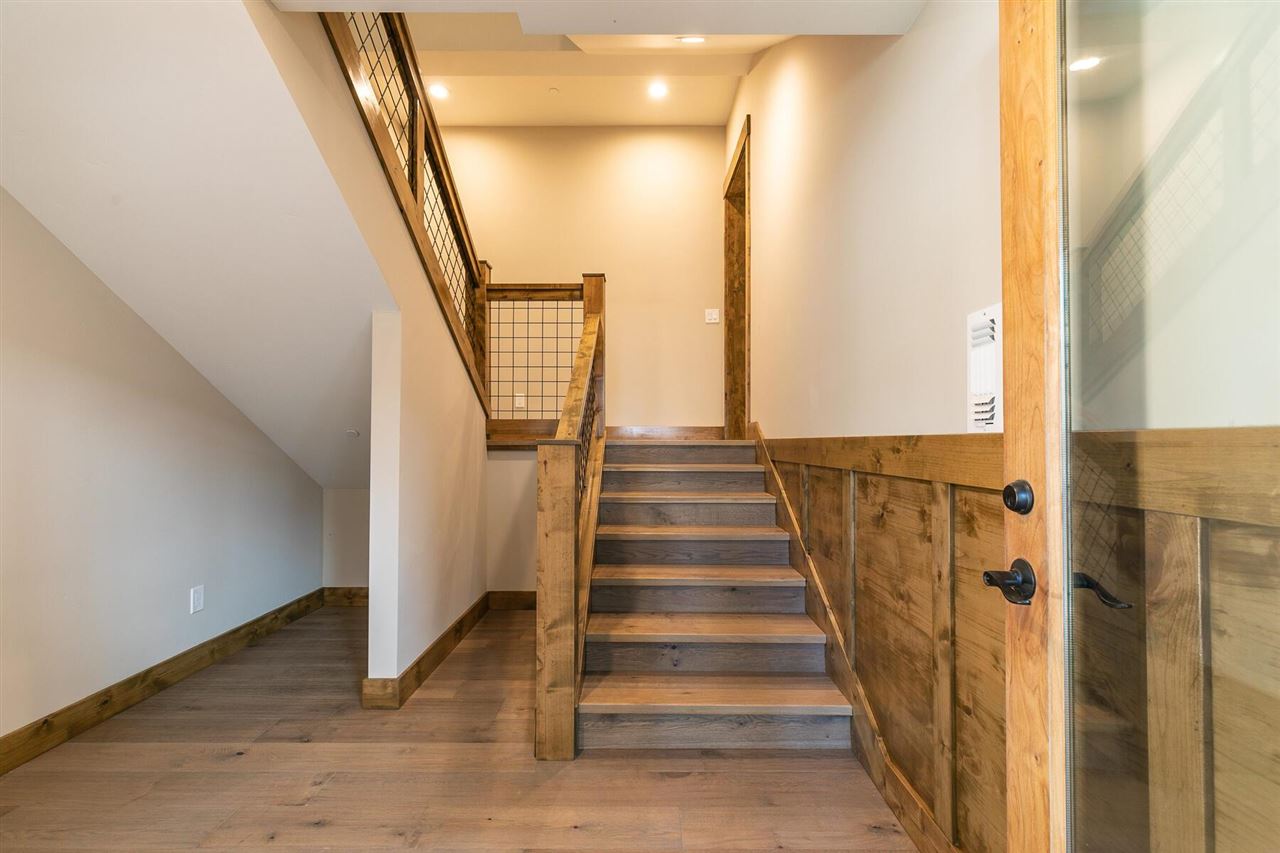 15611 Conifer Drive Truckee, CA 96161 - Photo 15 of 20 a view of staircase with wooden floor and white walls
