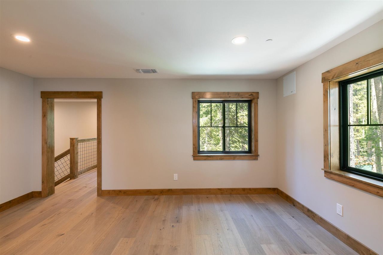 15611 Conifer Drive Truckee, CA 96161 - Photo 19 of 20 an empty room with wooden floor and windows