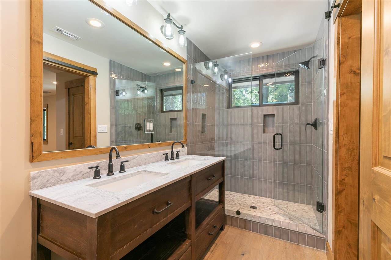 15611 Conifer Drive Truckee, CA 96161 - Photo 9 of 20 a bathroom with a sink mirror and a shower