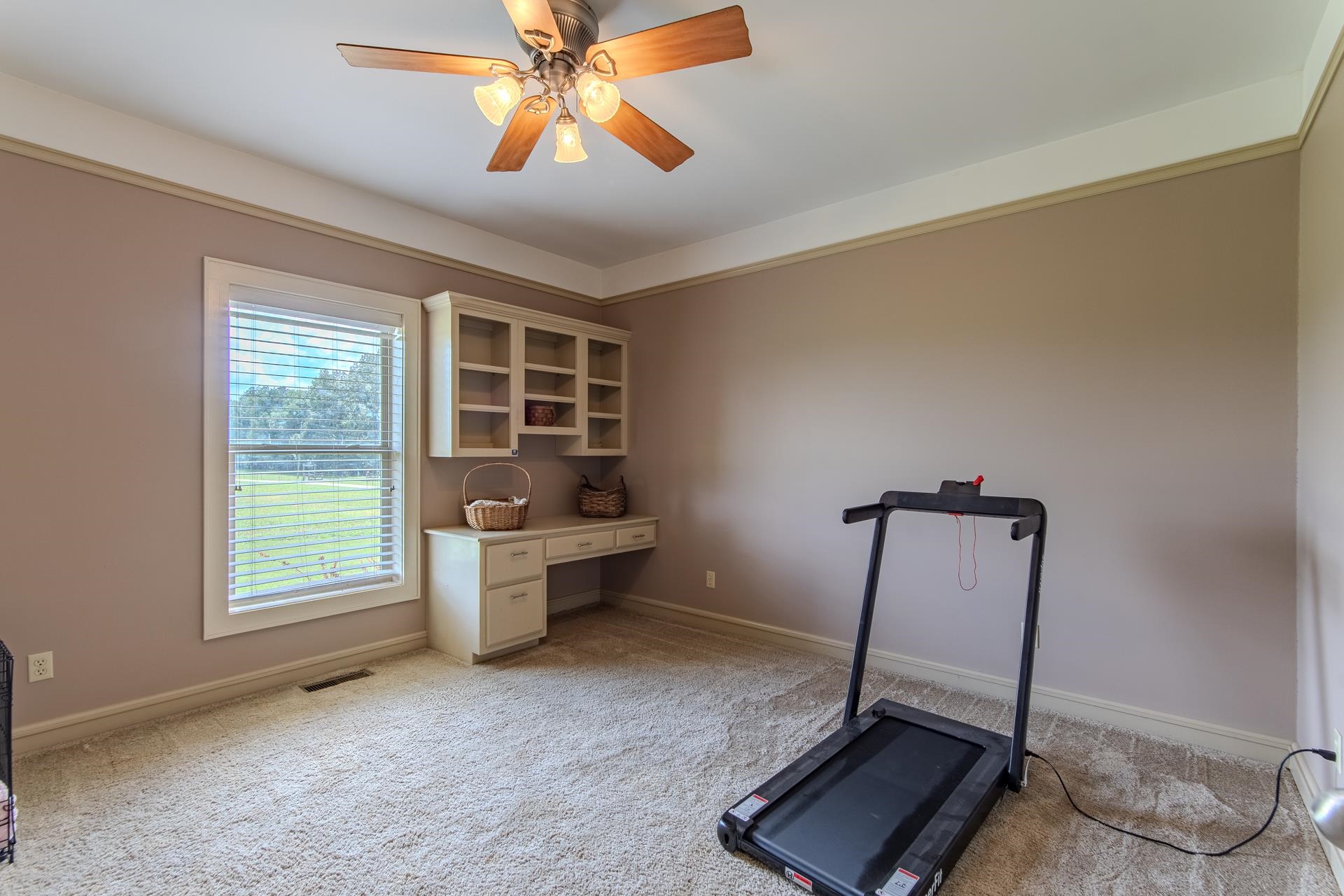 2690 Fellowship Road Sardis, TN 38371 - Photo 23 of 40 a room with gym equipment and a window
